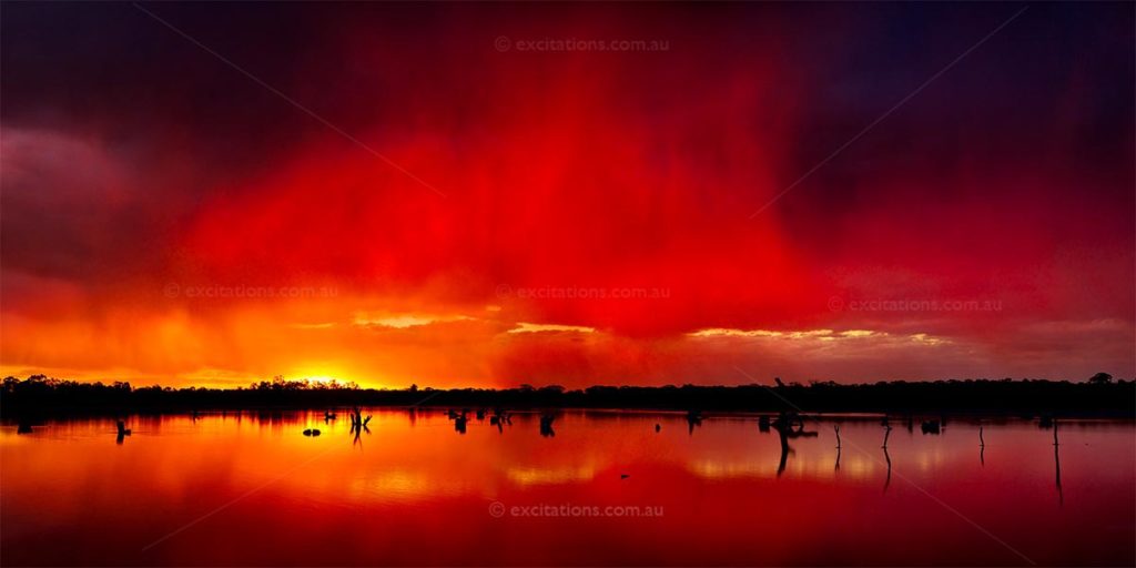 Spectacular red sunset over salt lake near Mildura, Victoria, Australia. Stock Photos of Mildura